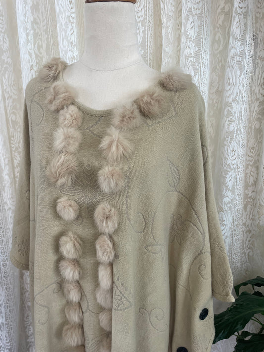 Cream boho poncho with pom poms, buttons and fringe