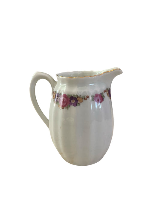 Vintage small creamer with bright floral design
