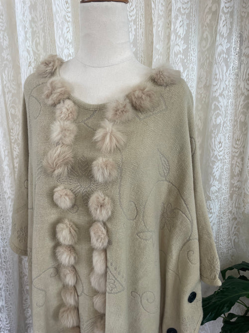 Cream boho poncho with pom poms, buttons and fringe