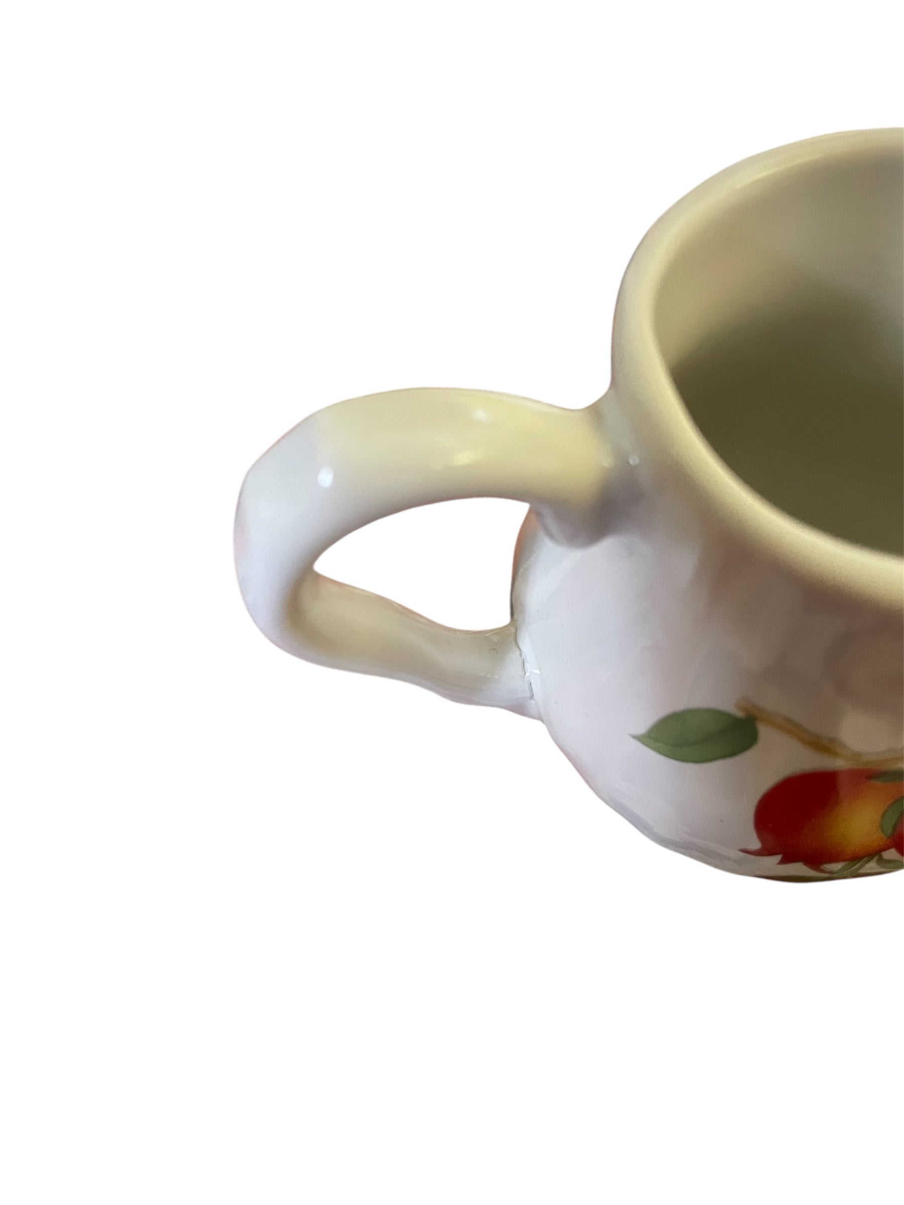 Mini porcelain creamer with orange flowers