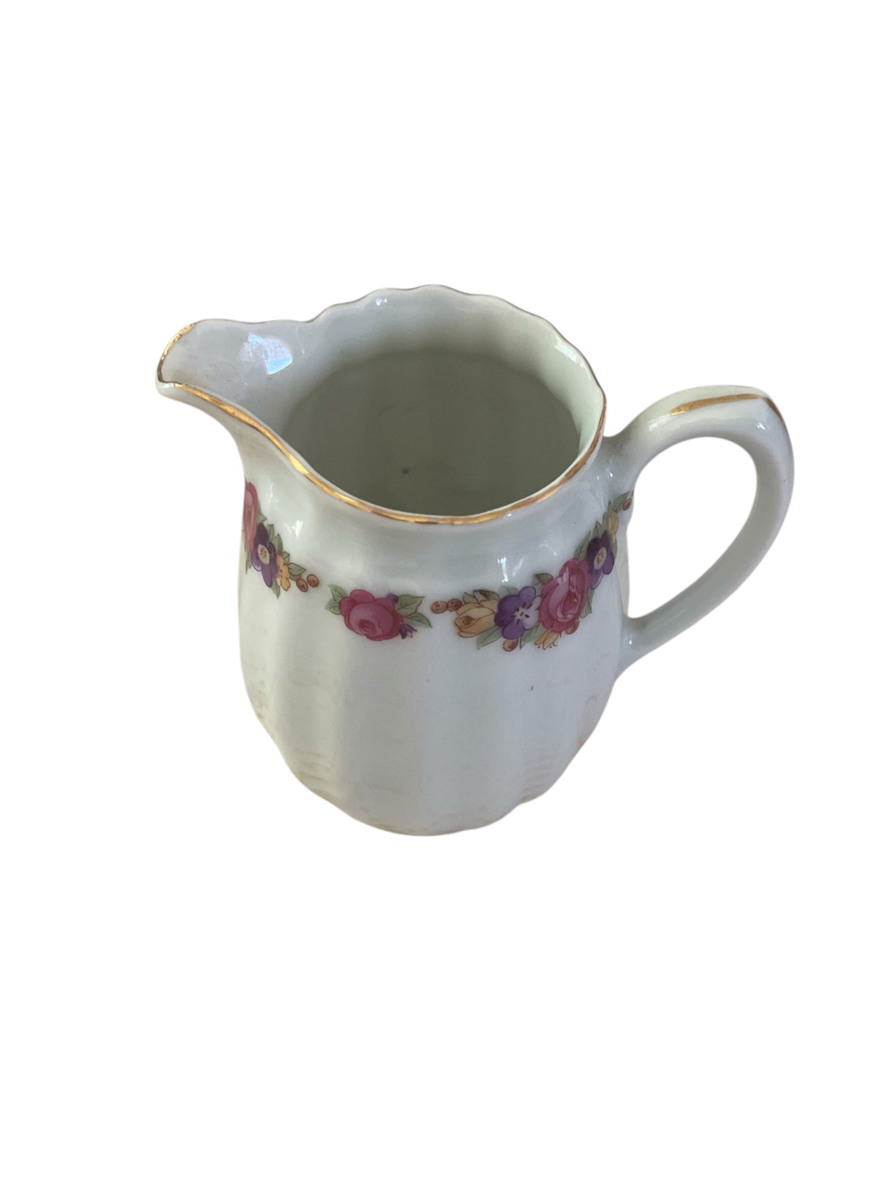 Vintage small creamer with bright floral design
