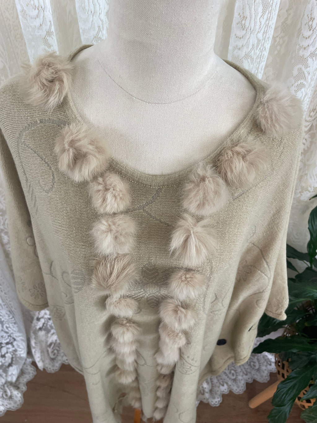 Cream boho poncho with pom poms, buttons and fringe