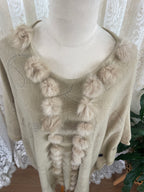 Cream boho poncho with pom poms, buttons and fringe