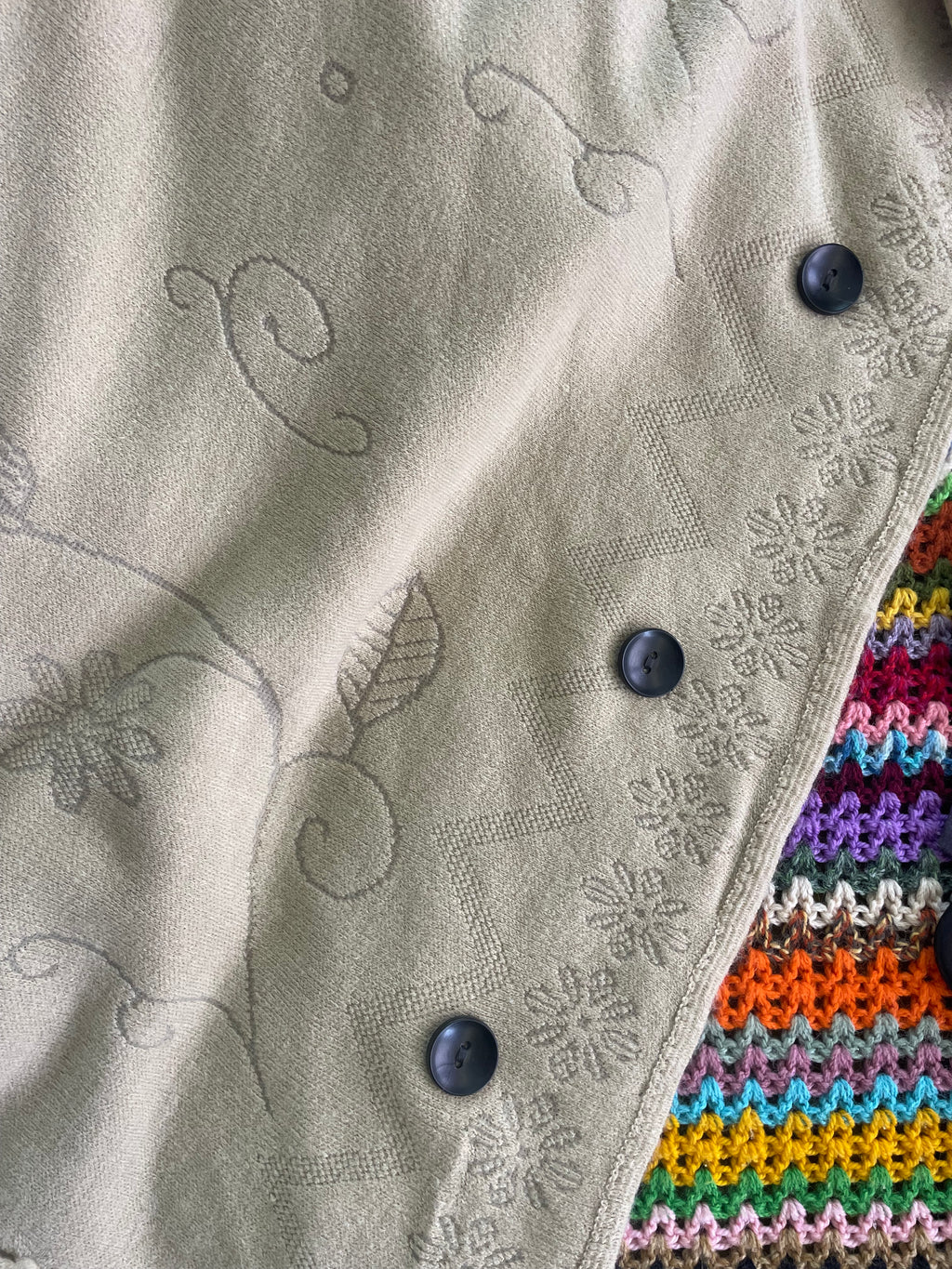Cream boho poncho with pom poms, buttons and fringe