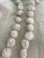 Cream boho poncho with pom poms, buttons and fringe