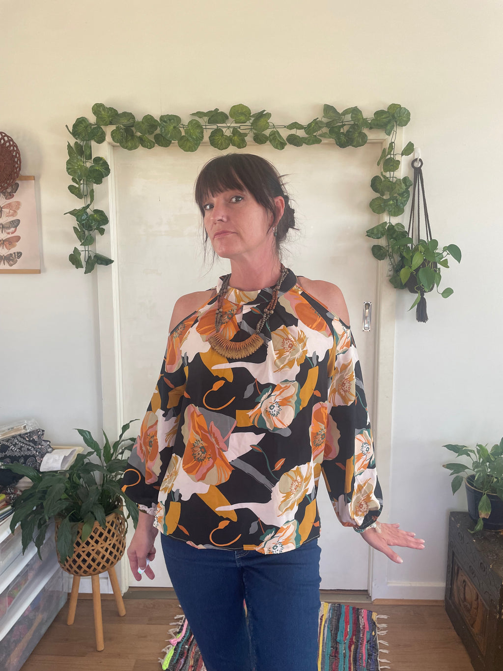 Peekaboo shoulder flowy floral blouse