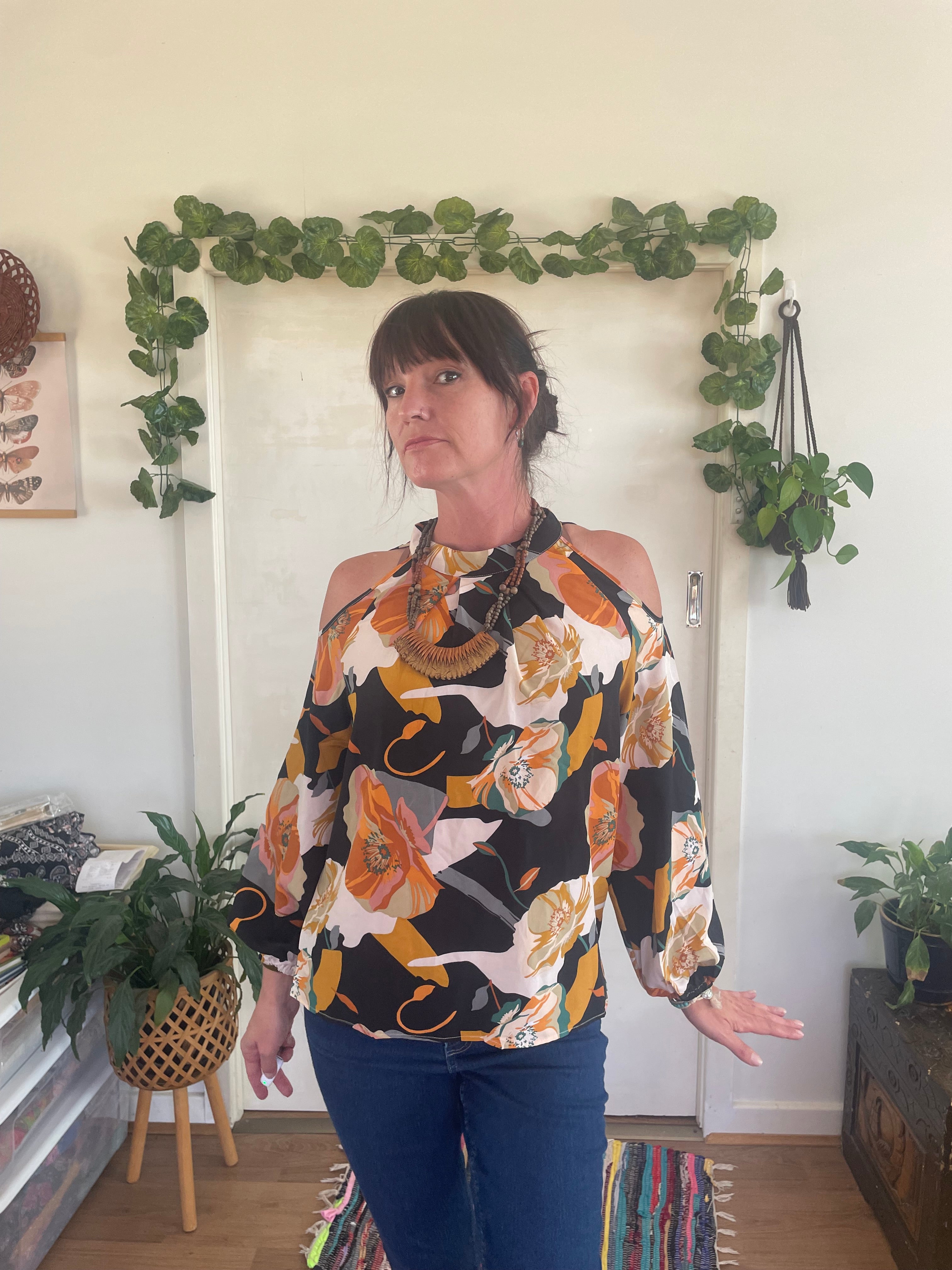 Peekaboo shoulder flowy floral blouse