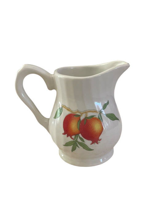 Mini porcelain creamer with orange flowers