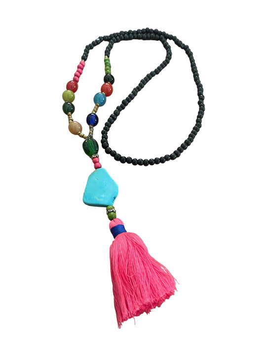 Long necklace with blue stone and pink tassel