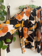 Peekaboo shoulder flowy floral blouse