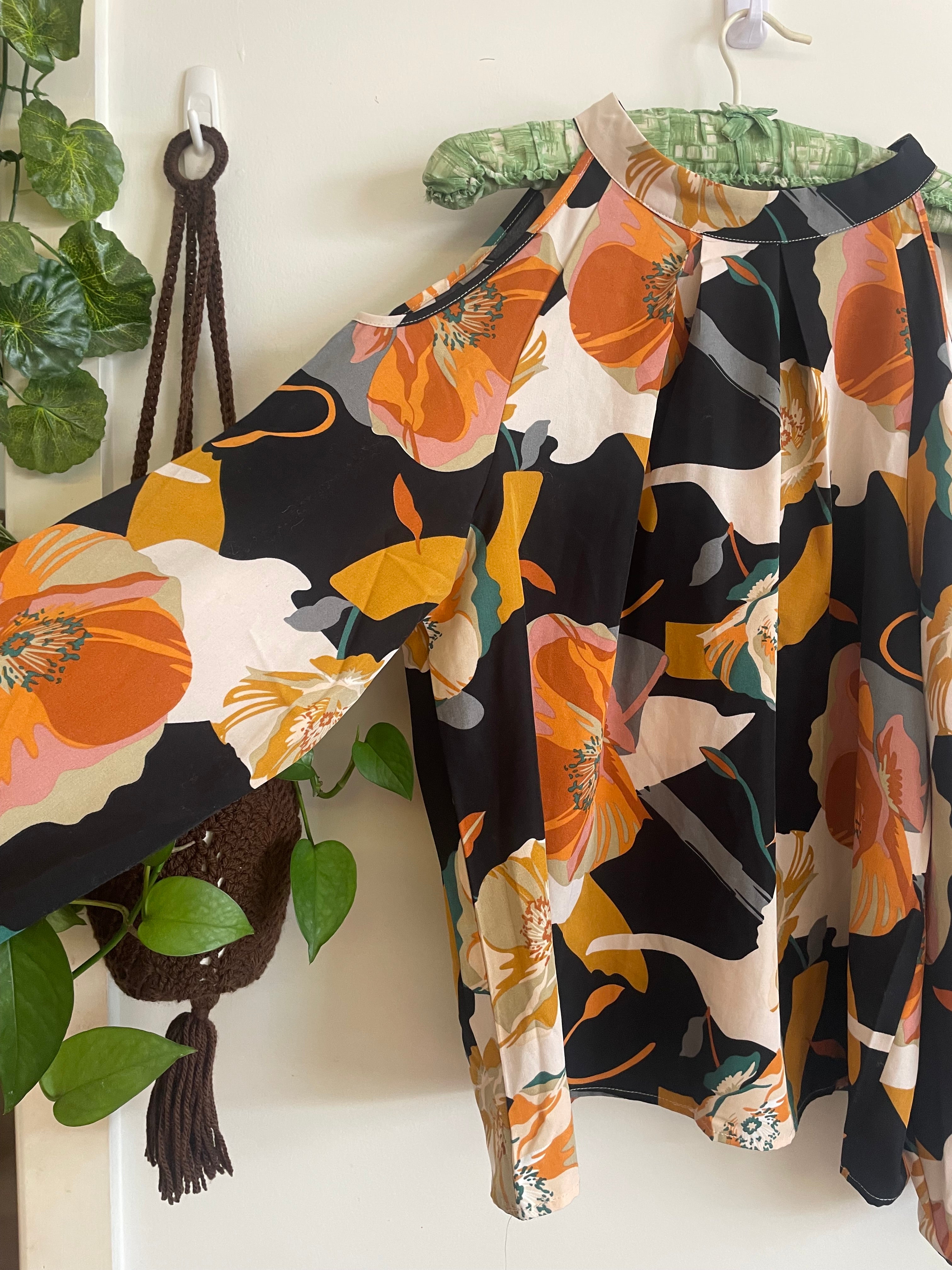 Peekaboo shoulder flowy floral blouse