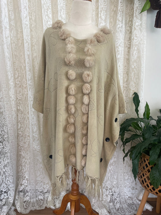 Cream boho poncho with pom poms, buttons and fringe