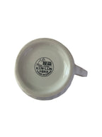 Mini porcelain creamer with orange flowers