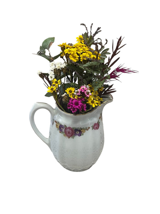 Vintage small creamer with bright floral design